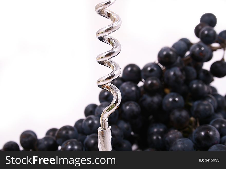 Closeup of bunch of black juicy grapes with drop of water over white