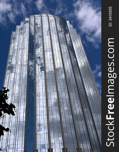 Unusual slightly curved modern skyscraper in boston against a cloud filled sky. Unusual slightly curved modern skyscraper in boston against a cloud filled sky