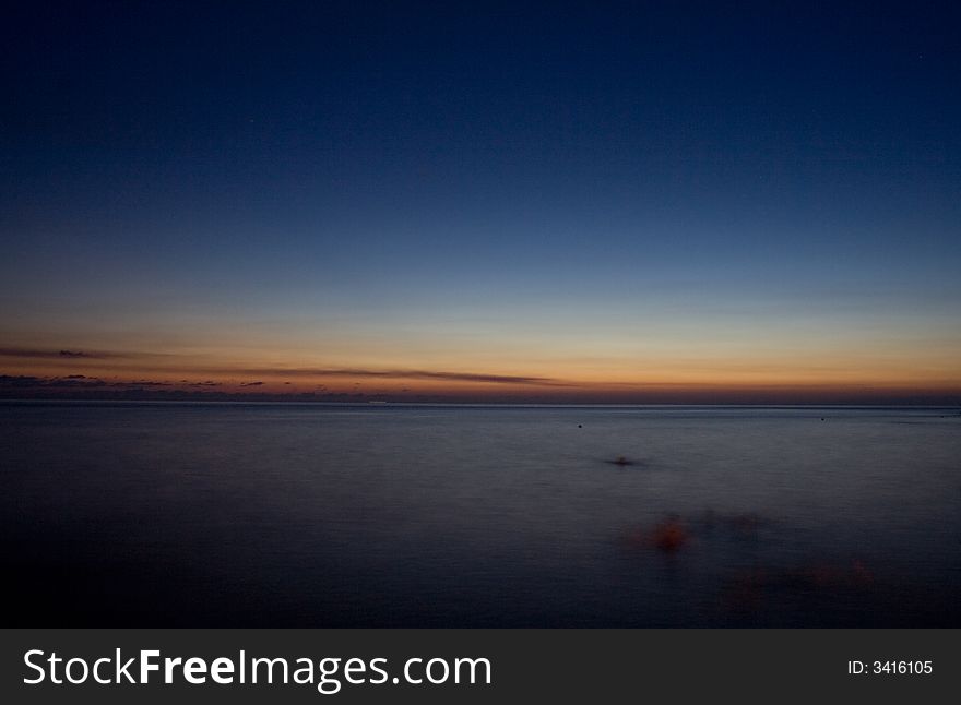 Sunset in the silent evening on seacoast