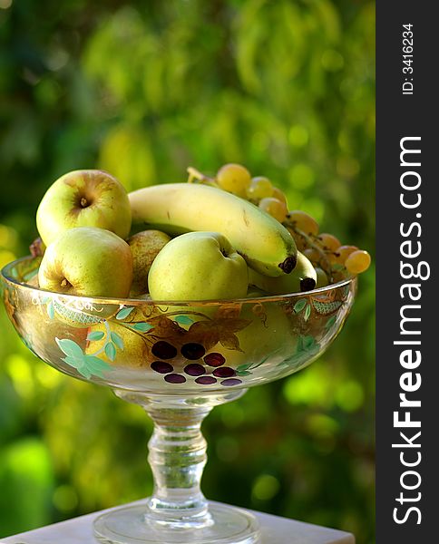 Yellow and green fruits on basket of fruit.