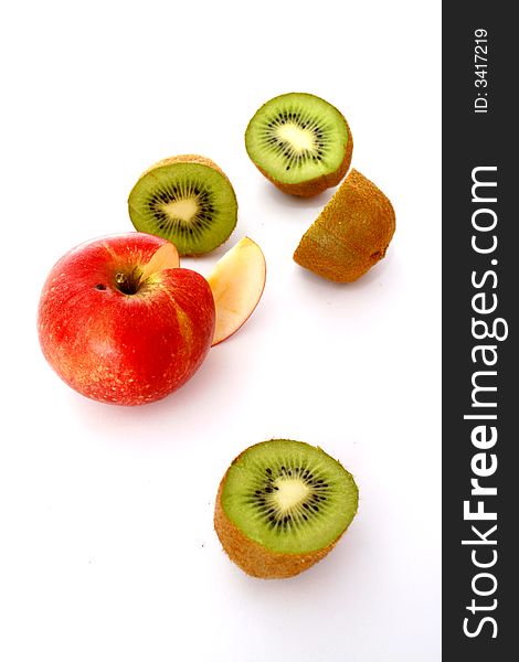 Green kiwi and a red apple. Green kiwi and a red apple