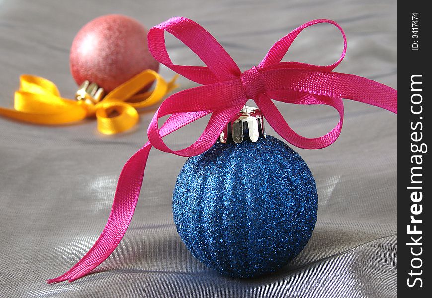 Colorful christmas baubles with bows