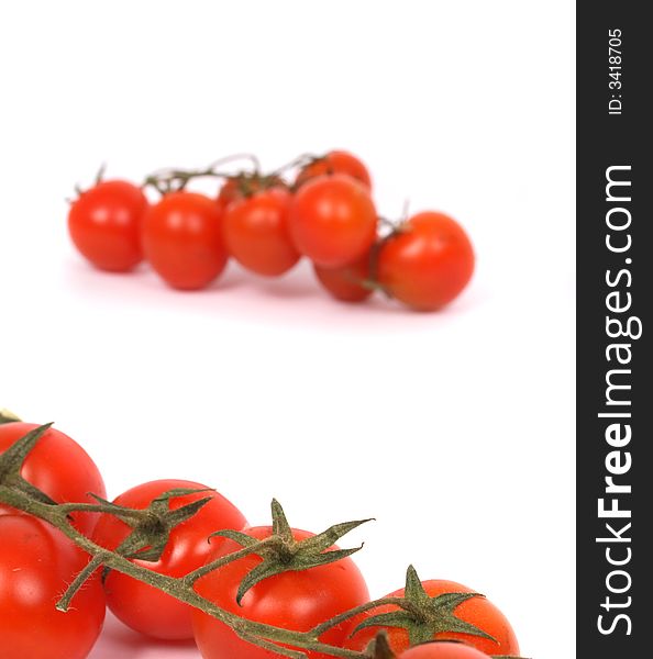 Fresh red tomatoes on the white background