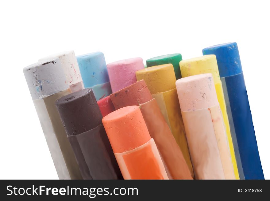 Colorful pastel crayons with painted wrappers