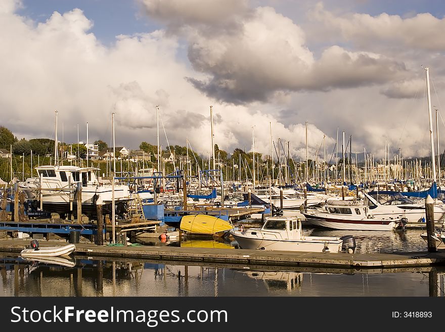 A bright yellow rowboat in a marina. A bright yellow rowboat in a marina