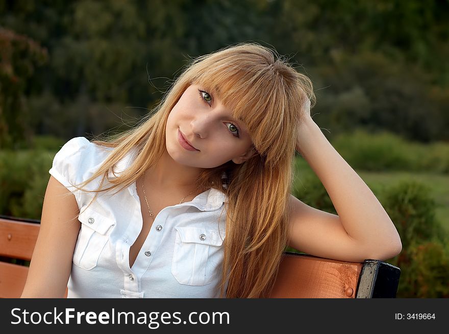 Girl Sitting In Park