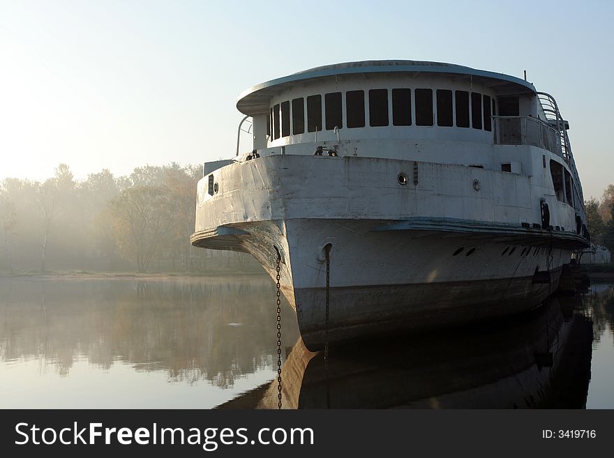 Abandoned and broken ship in morning haze. Abandoned and broken ship in morning haze.