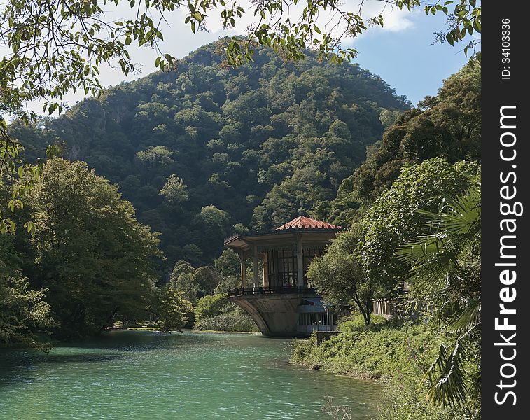 House on the banks of the river in the mountains