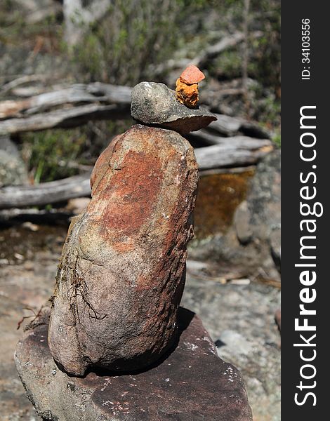 A stone man, symbolizing a safe onward journey, is often encountered in the bushland of the Grampians National Park. To some it's just a stack of rocks, to others the perfect balance amongst the surrounding stones represents Zen. A stone man, symbolizing a safe onward journey, is often encountered in the bushland of the Grampians National Park. To some it's just a stack of rocks, to others the perfect balance amongst the surrounding stones represents Zen