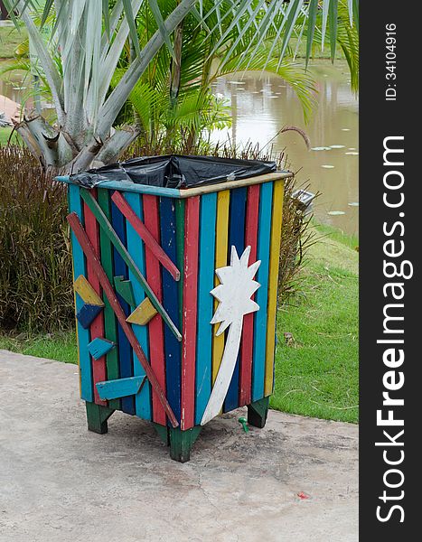 Colorful bin in the park. Trash container