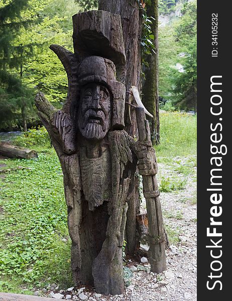 Wooden slavic idol in the forest