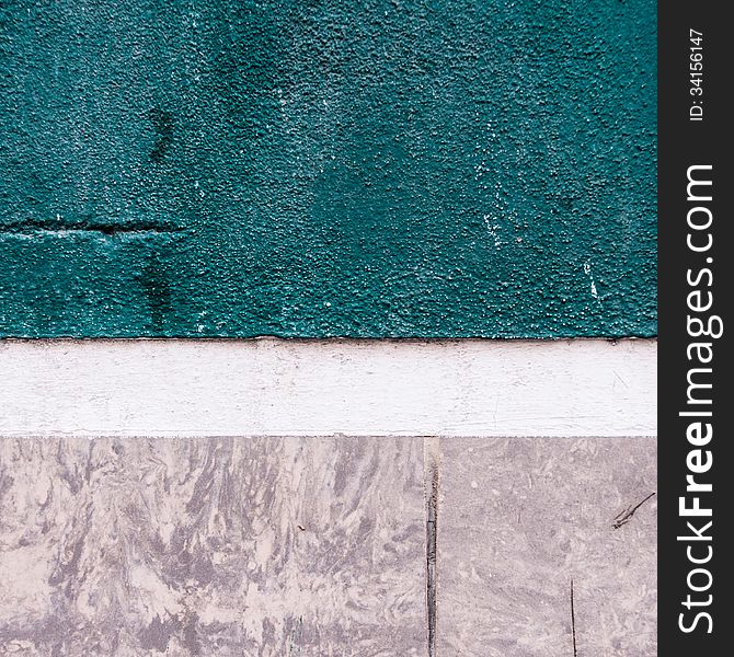 Closeup of a turquoise, grey and white facade of a house. Closeup of a turquoise, grey and white facade of a house