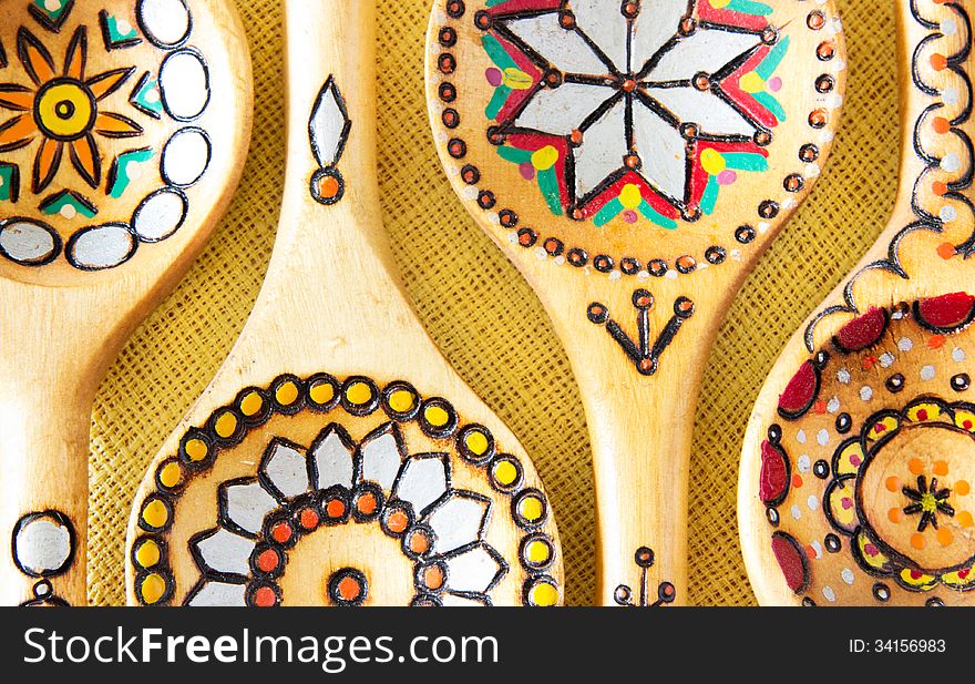 Wooden ornament spoons on tablecloth. Wooden ornament spoons on tablecloth.