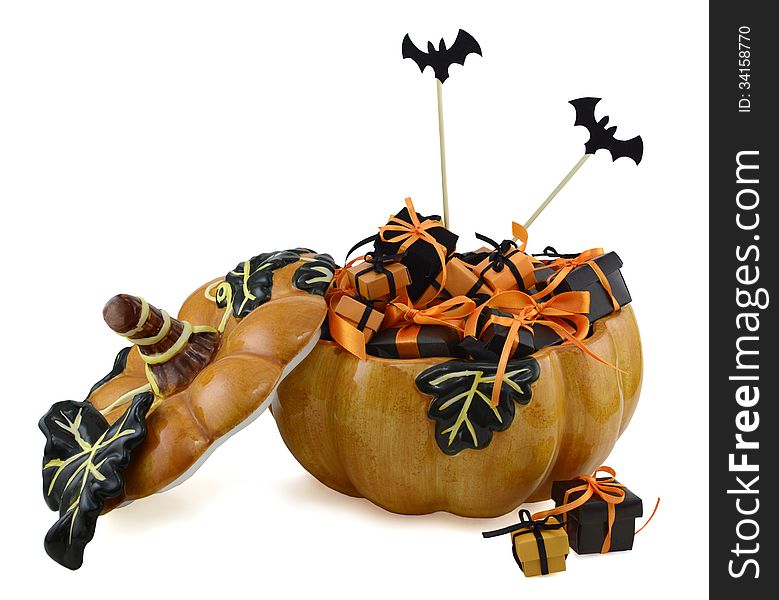 Halloween pumpkin full of gifts with bat cutouts isolated. Halloween pumpkin full of gifts with bat cutouts isolated