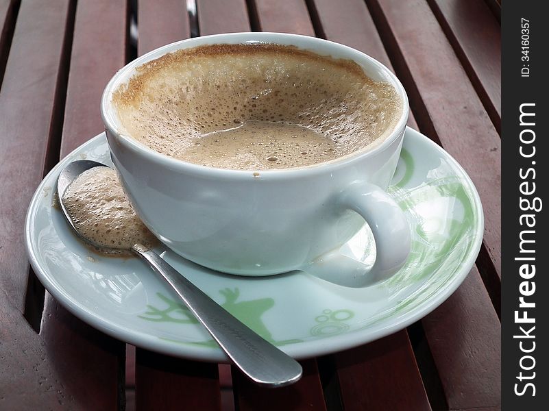 Coffe with white cup on red table. Coffe with white cup on red table