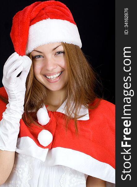 A woman enjoys a holiday in santa clothing. A woman enjoys a holiday in santa clothing