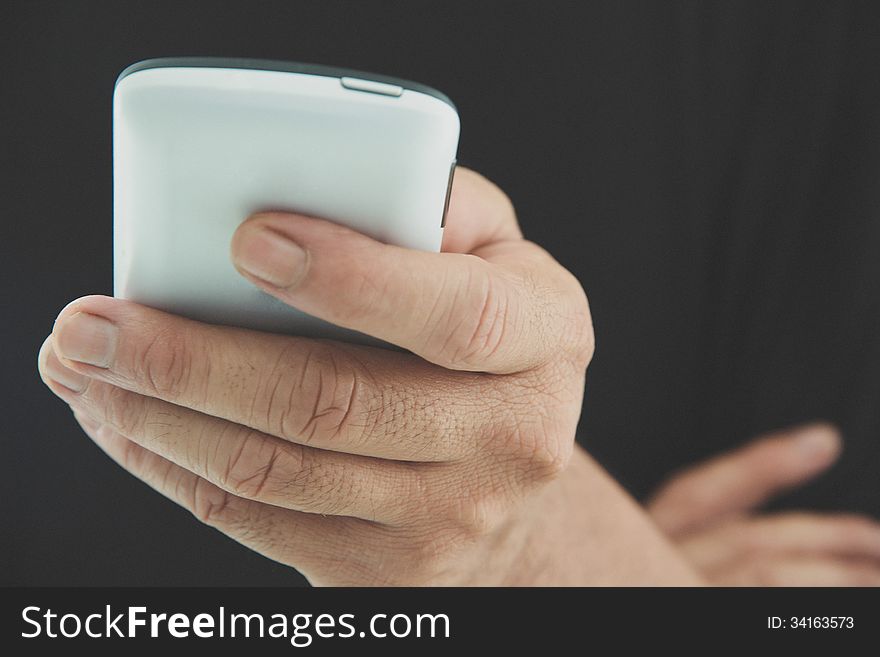 Image of man checking his phone