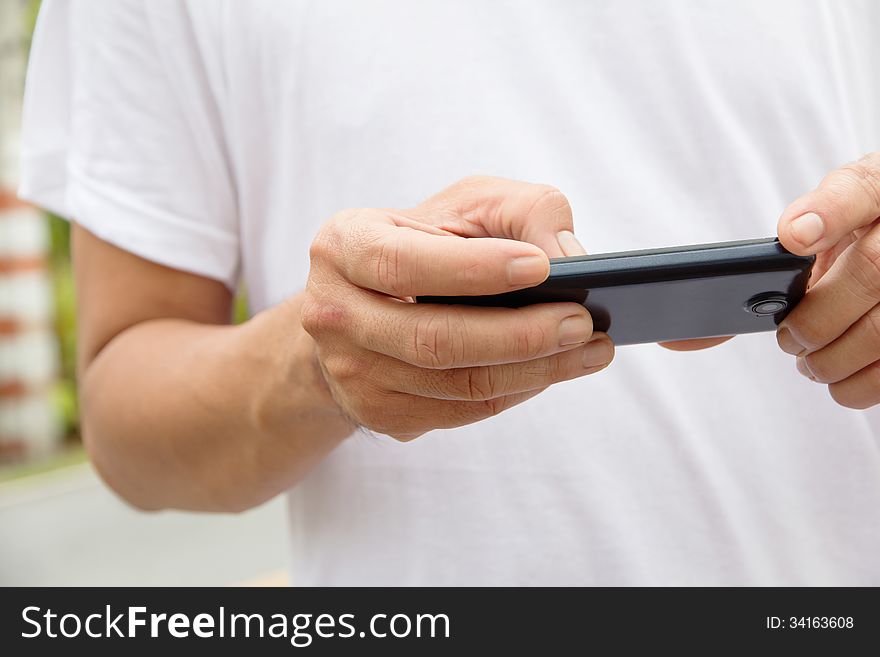 Image of man checking his phone