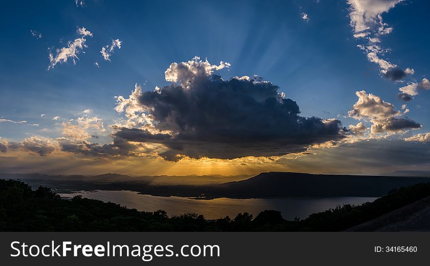 Clouds sun shine ray through. Clouds sun shine ray through