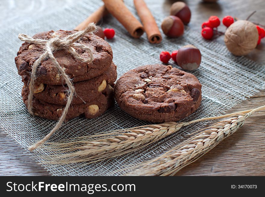 Cookies and nuts on the table with ears of wheat