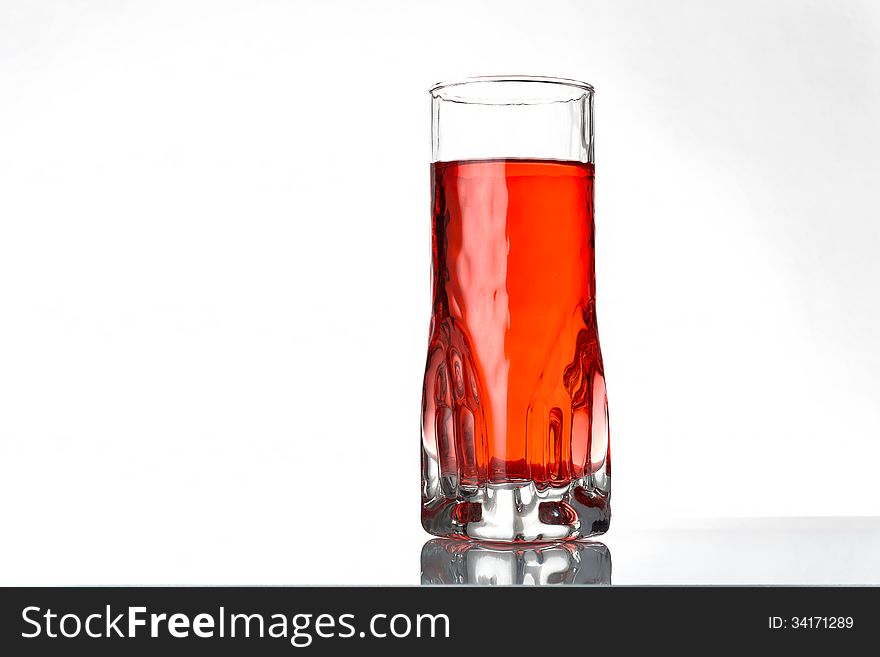 A fresh currants flavoured drink on grey background