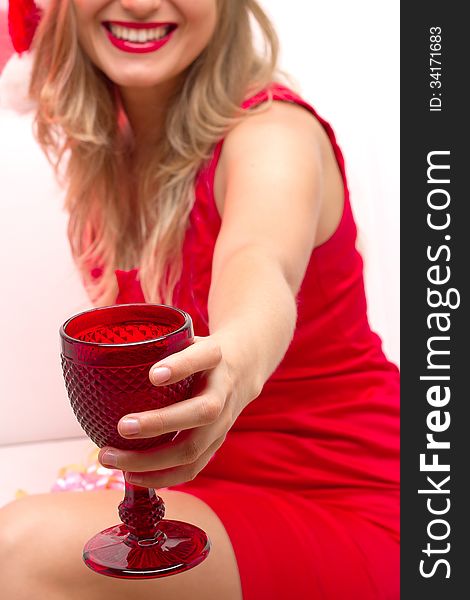 Christmas Santa hat woman portrait. Beautiful girl hold wine glass.