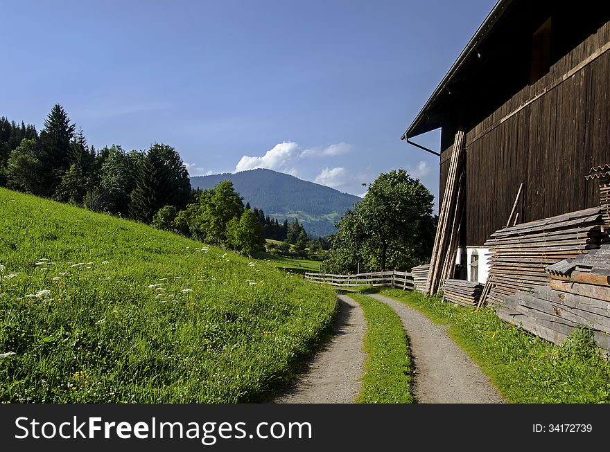 Trail behind an old barn in Austria.