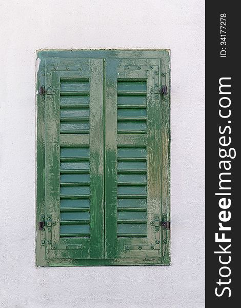Window with green shutters