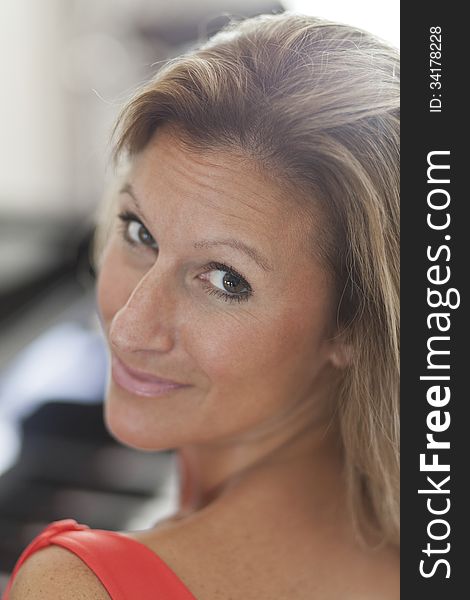 Portrait Of A Beautiful Woman Smiling At The Camera At Home