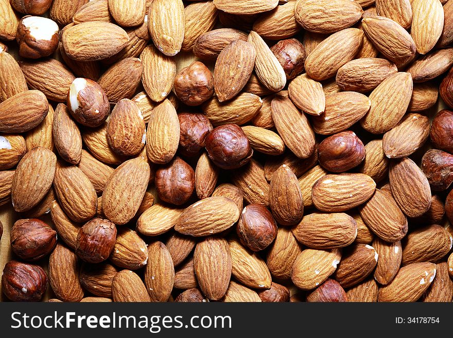 Extreme closeup of almonds and filbert nuts. Nice background. Extreme closeup of almonds and filbert nuts. Nice background