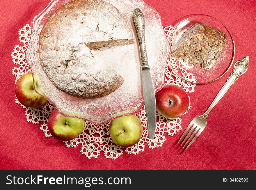 Applesauce raisin rum cake for christmas table. Table decorated with lacy napkin. From series of Merry Christmas