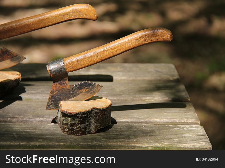 A Hand Axe Secured into a Block of Wood. A Hand Axe Secured into a Block of Wood.