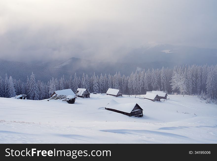 Winter landscape with snow-covered mountain villages. Carpathians, Ukraine