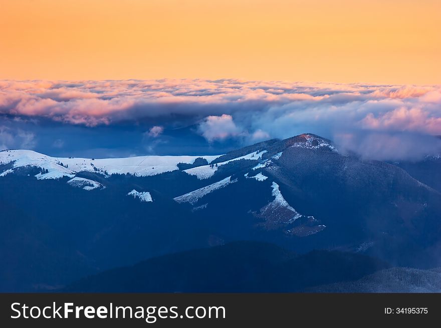 Winter landscape with sunrise in the mountains. Carpathians, Ukraine. Winter landscape with sunrise in the mountains. Carpathians, Ukraine