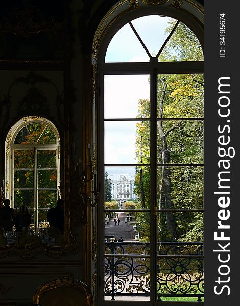 Atherine Palace, St. Petersburg. View through a semi-circular window in the Hermitage palace garden. Atherine Palace, St. Petersburg. View through a semi-circular window in the Hermitage palace garden