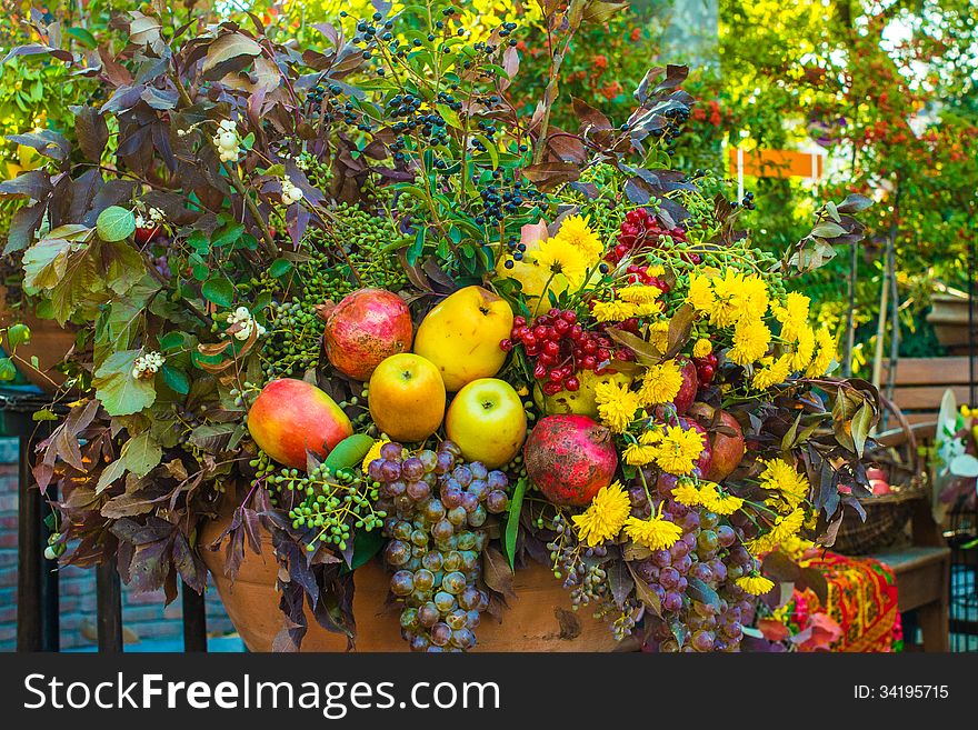 Autumn bouquet of flowers and fruits