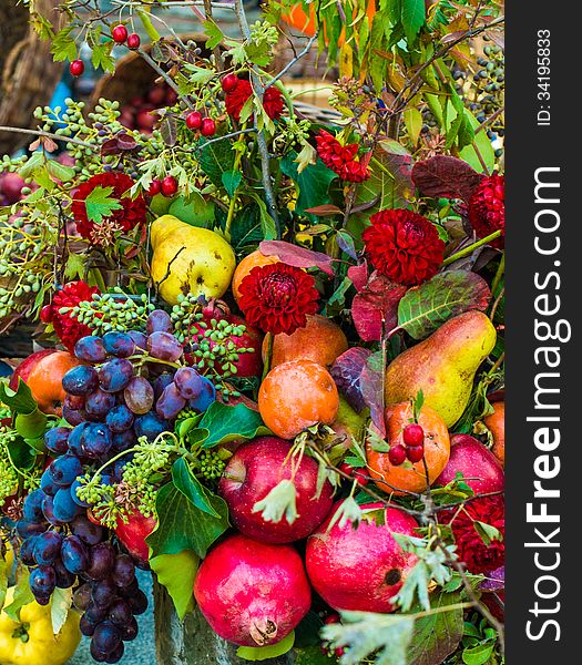 Autumn bouquet of flowers and fruits