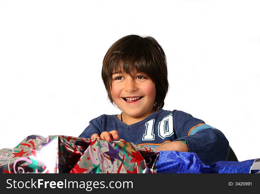 Digital photo of a little boy  unwrap his gifts. Digital photo of a little boy  unwrap his gifts.