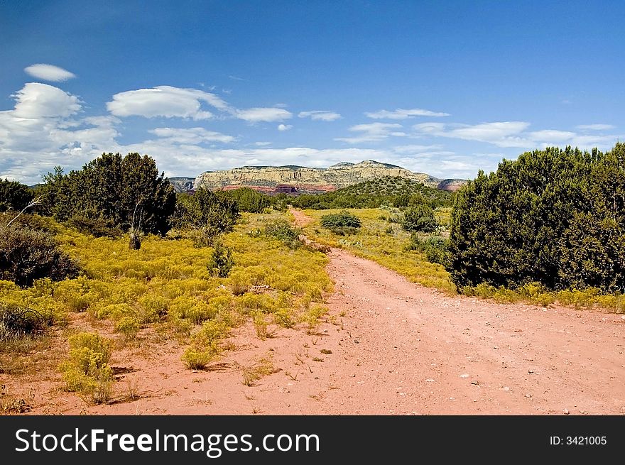 A road leading to the mountains of sedona. A road leading to the mountains of sedona