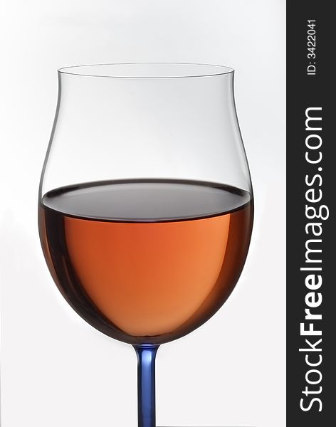 A glass filled with red wine. it shows a celebration drink. A glass filled with red wine. it shows a celebration drink