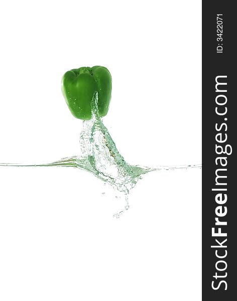 A green pepper splash out from water.. showing freshness, energy and healthy