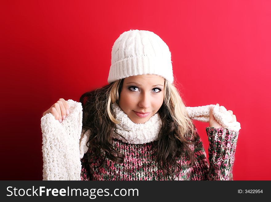 Winter portrait of a beautiful young woman with a cap and a scarf. Winter portrait of a beautiful young woman with a cap and a scarf