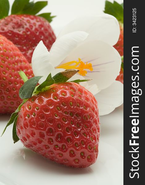 Decorated strawberry dessert on a white backgorund