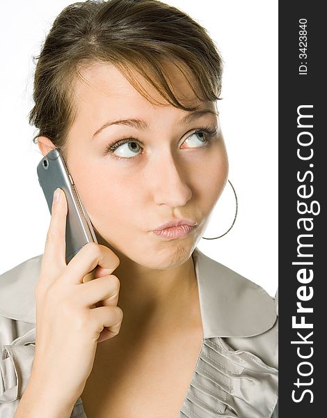 Attractive young woman calling by cellular phone  over white background. Attractive young woman calling by cellular phone  over white background