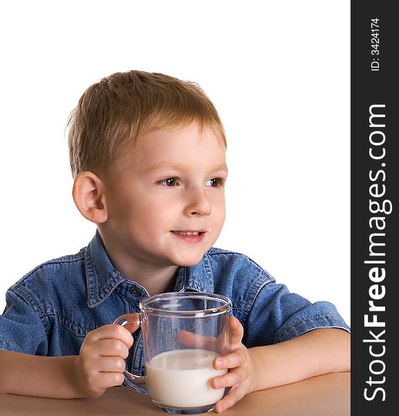 The child drinks milk from a mug