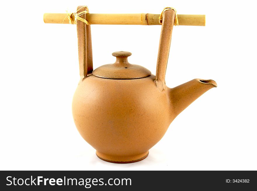 A teapot with heating from a candle, for green tea.