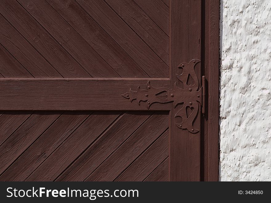 Part of a rural gate with  forged metal staple. Part of a rural gate with  forged metal staple