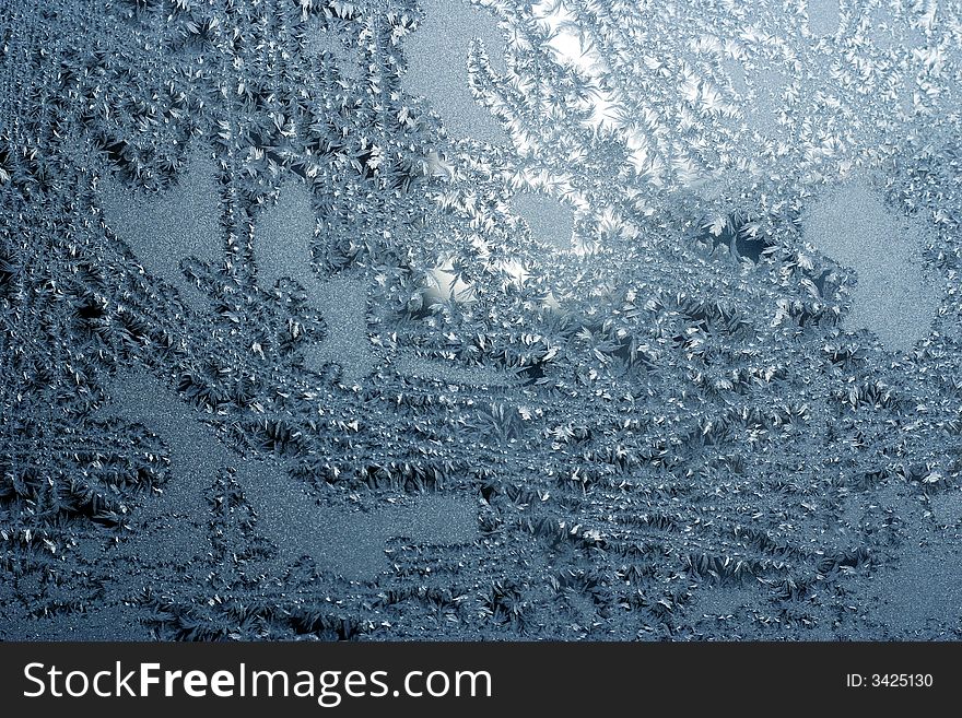 blue frosty pattern on windowpane