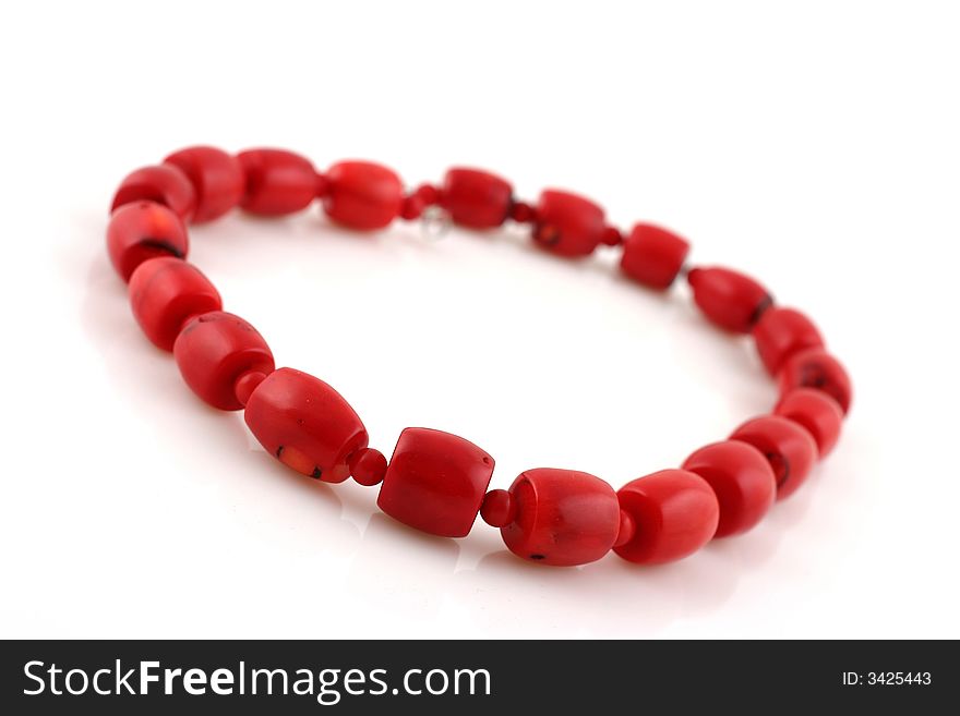 Red beads on white background