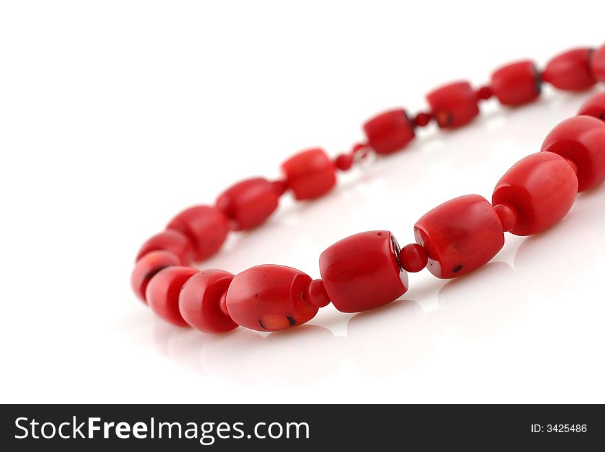 Red beads on white background